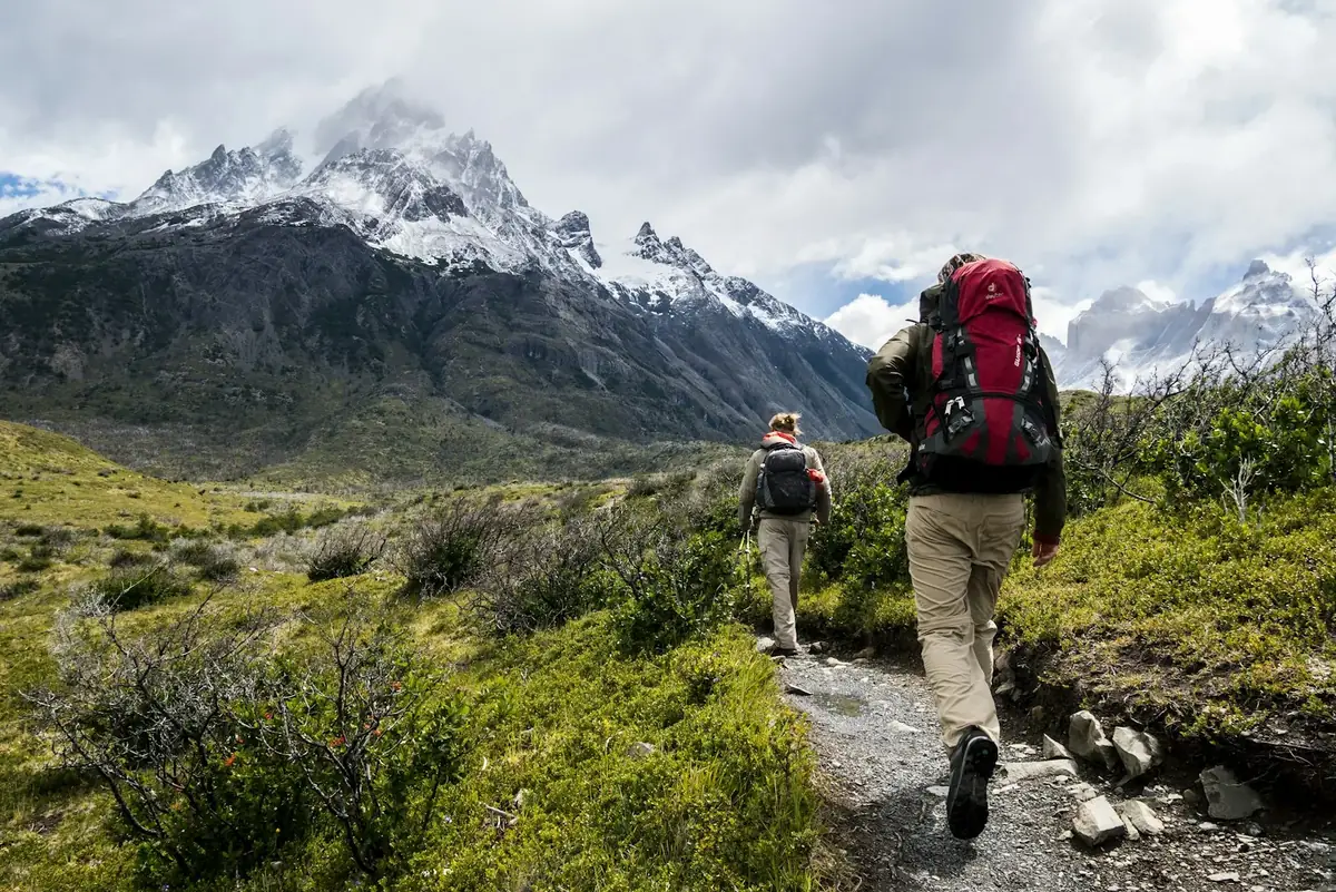 Hikers on a mountain ridge trail